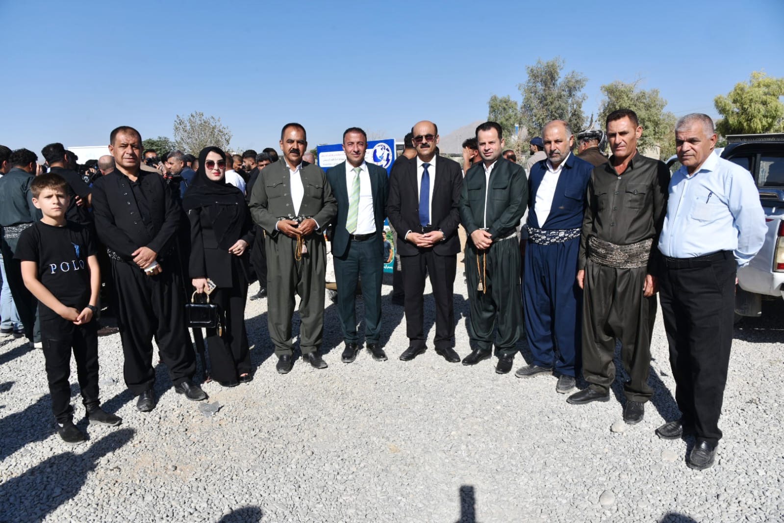 Association leadership with local officials and community representatives at an official event.