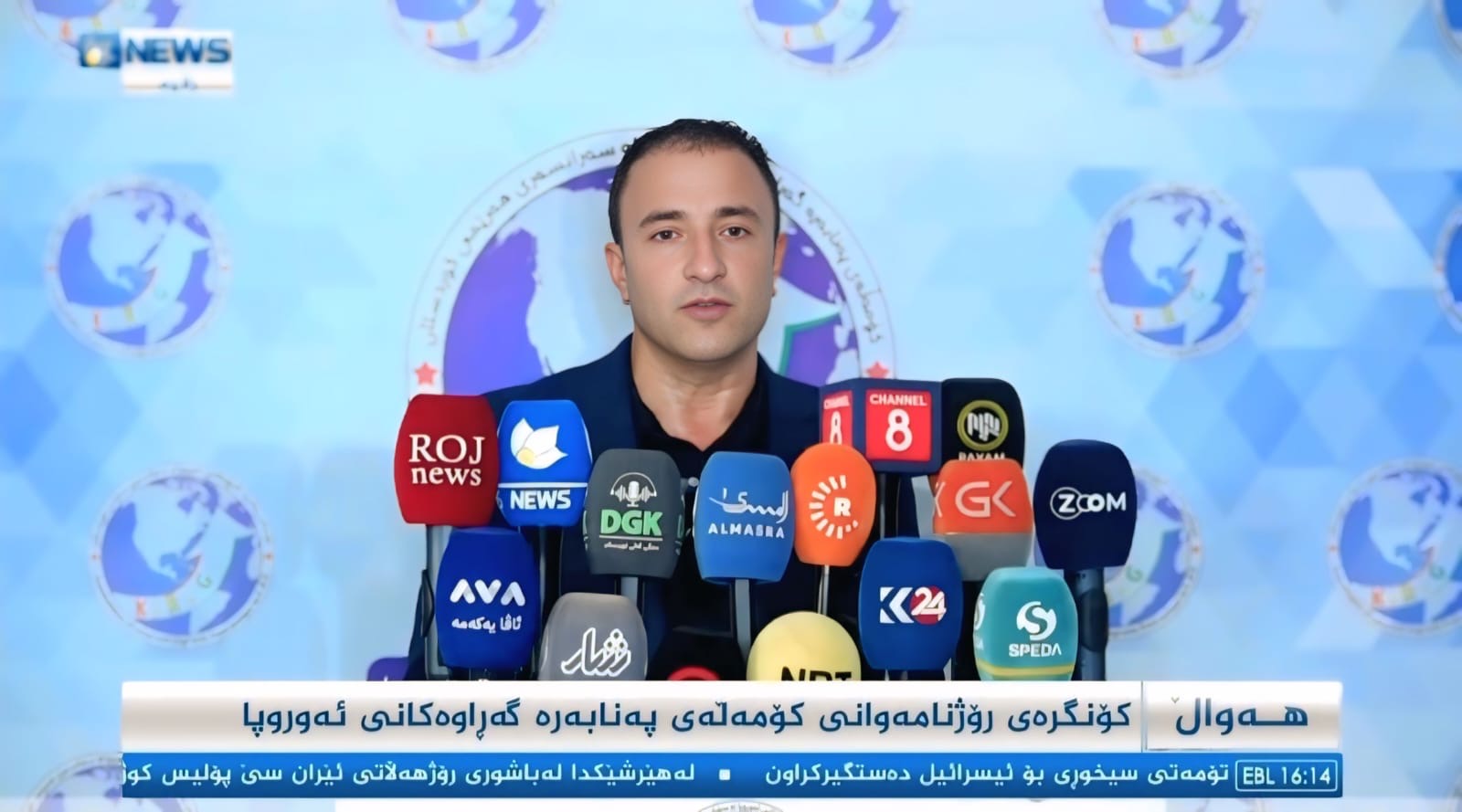 Association press conference addressing Kurdish and international media on migration policy.